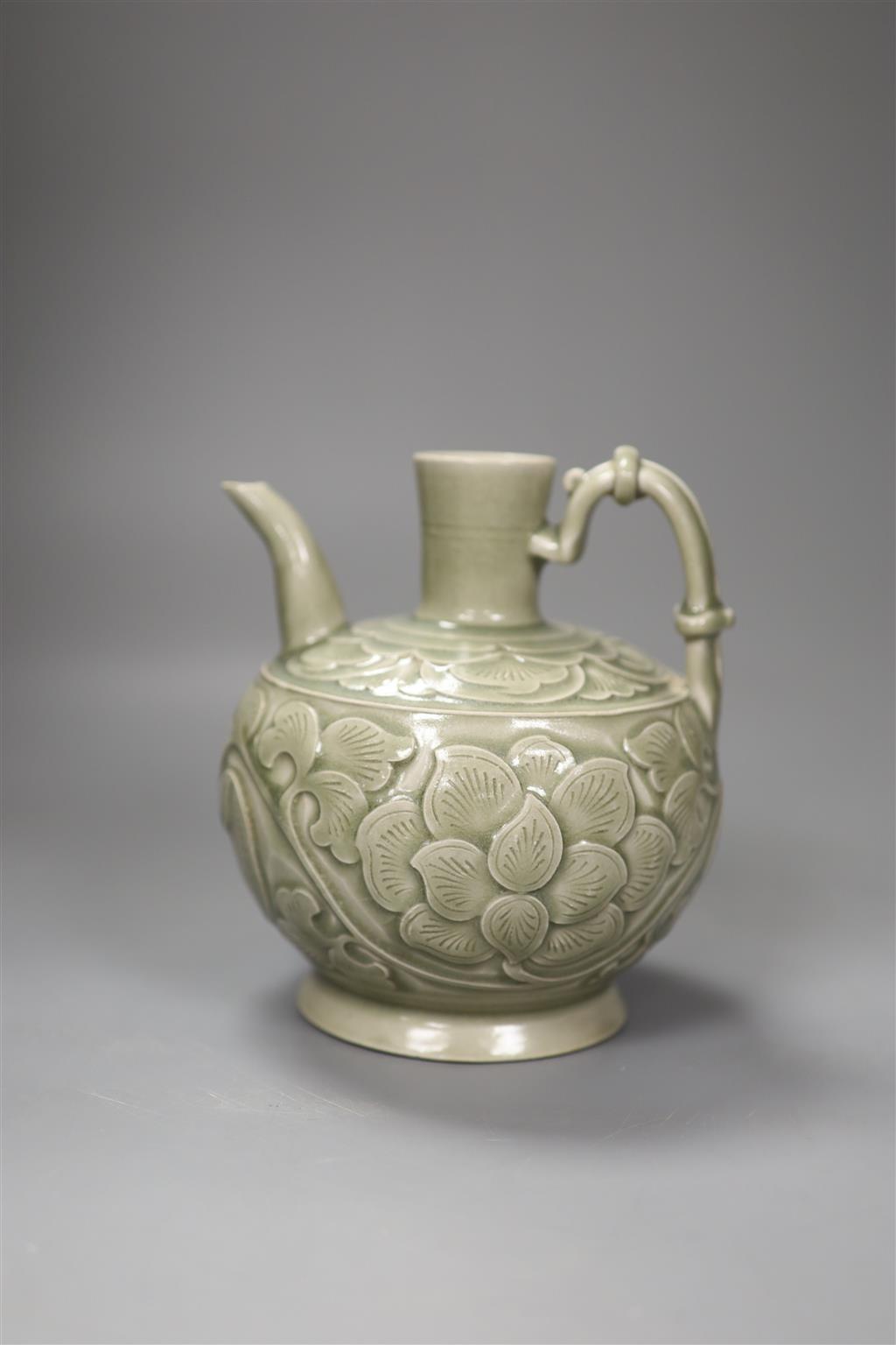 A Chinese carved celadon ewer, 16cm high